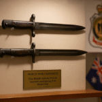 World War I bayonets display with flag background.