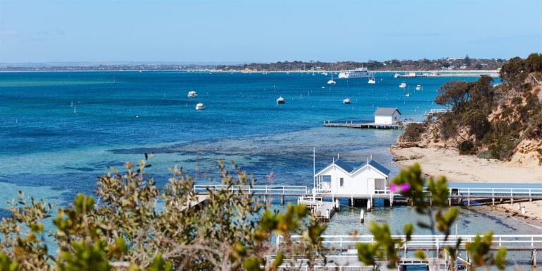 Sorrento beach with pier and blue ocean view.