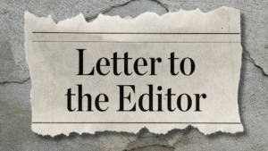 Newspaper reads 'Letter to the Editor' on wall.