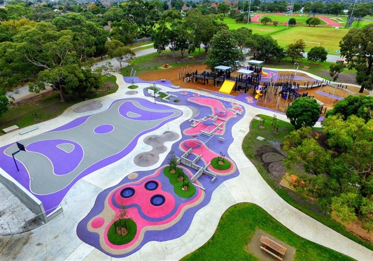 Colourful playground with slides and climbing structures.