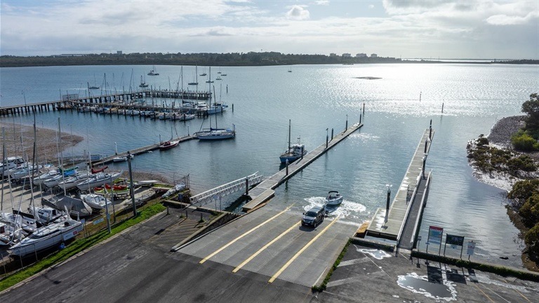 Boat ramp with marina and parked yachts view