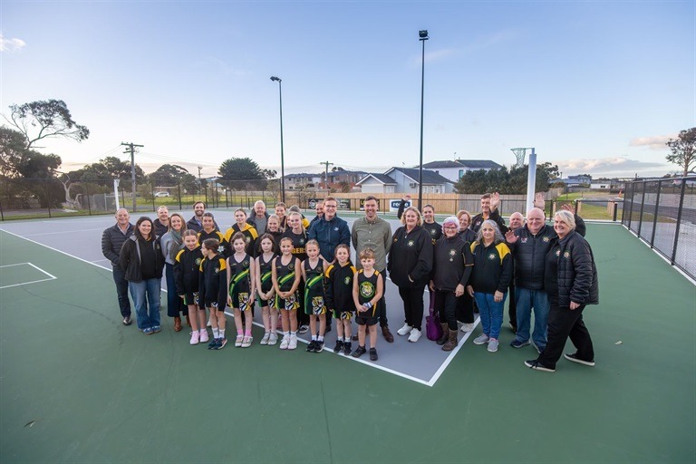 Group photo on outdoor basketball court