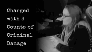 Person at desk, charged with criminal damage.