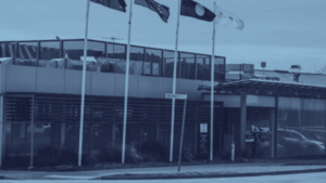 Building with Australian flags outside.