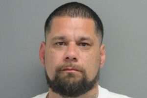 Man with beard staring at camera.