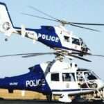 Two police helicopters on airport runway