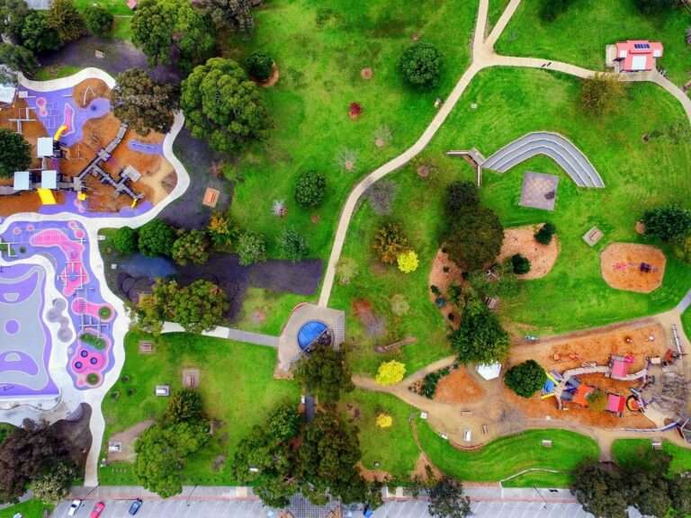 Aerial view of colourful playground and park paths.