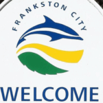 Frankston City welcome sign with dolphin logo.