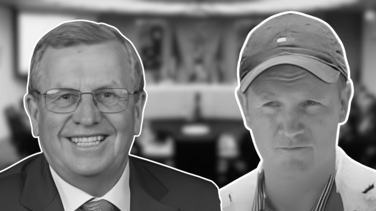 Two men in a business meeting, black and white.