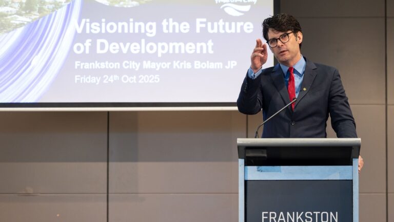 Speaker addressing Frankston development conference.