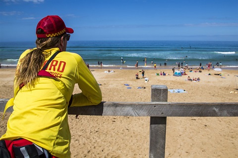 Surf lifesaver watching beach users